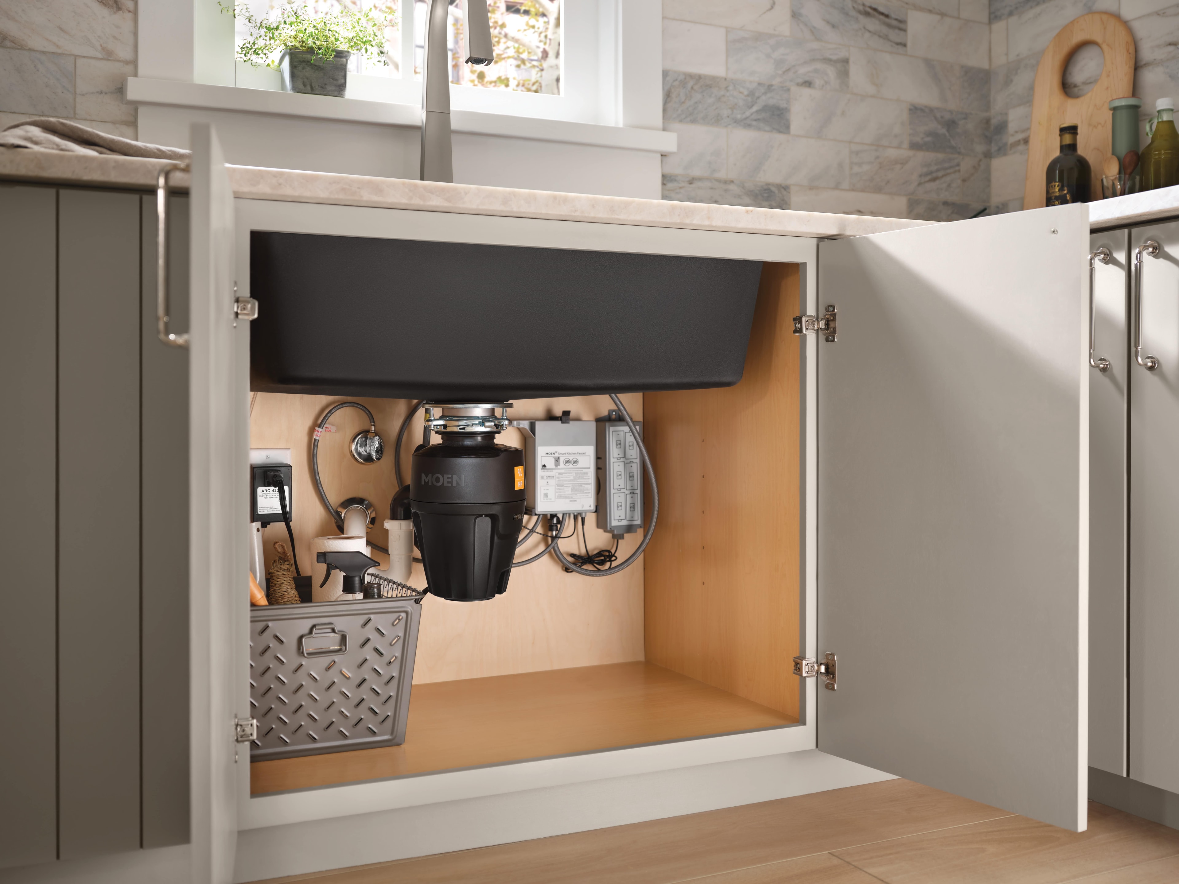 Handle free faucet with components under the sink.